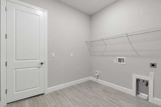 3563 Santa Caterina Blvd, Bradenton, FL 34211 - laundry area featuring hookup for a washing machine, electric dryer hookup, light wood-style floors, baseboards, and laundry area