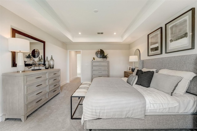 bedroom with visible vents, baseboards, recessed lighting, a raised ceiling, and light colored carpet