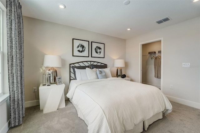 carpeted bedroom featuring visible vents, recessed lighting, and baseboards