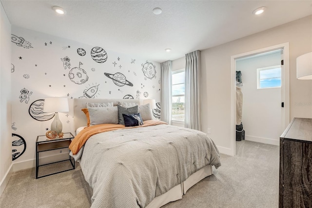 bedroom with recessed lighting, light colored carpet, and baseboards