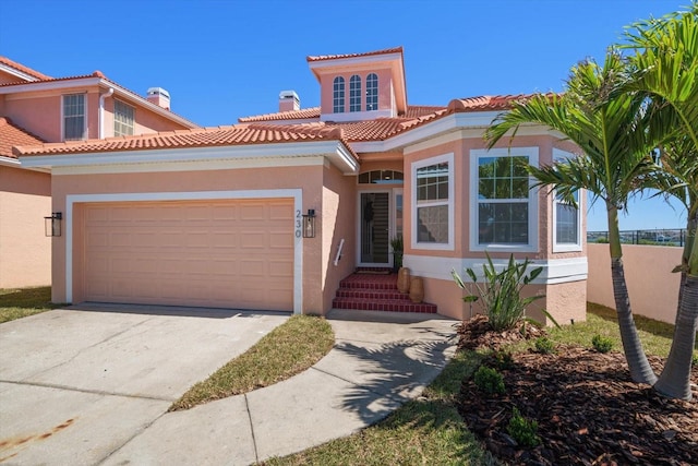 mediterranean / spanish-style home featuring a tile roof and stucco siding