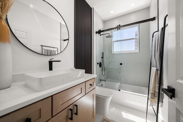 bathroom with recessed lighting, bath / shower combo with glass door, toilet, and vanity