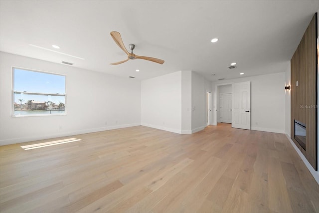 unfurnished living room with visible vents, baseboards, light wood-type flooring, recessed lighting, and a ceiling fan