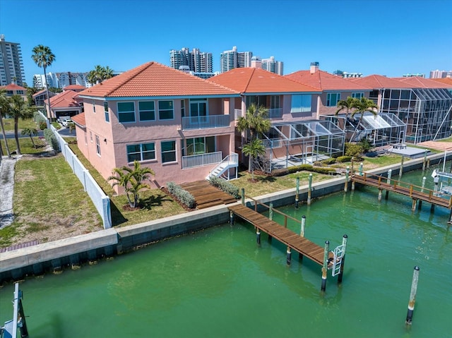 dock area featuring a water view and fence