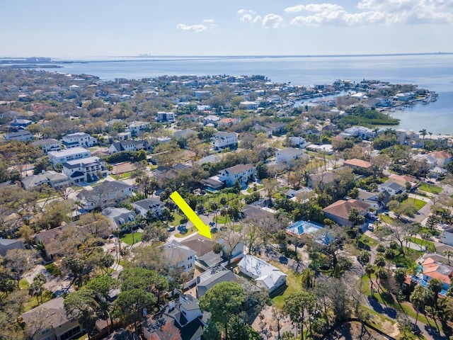 bird's eye view featuring a water view and a residential view