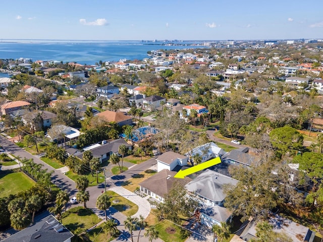 birds eye view of property with a residential view and a water view