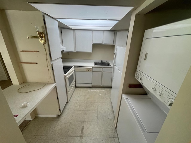 kitchen with a sink, light floors, white appliances, light countertops, and custom exhaust hood