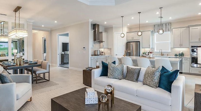 living area featuring recessed lighting, crown molding, and baseboards