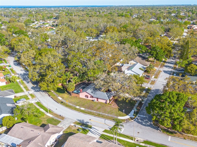 birds eye view of property with a wooded view and a residential view