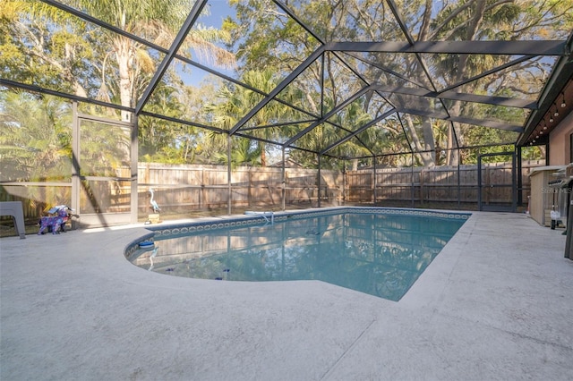 view of pool featuring a patio area, a fenced backyard, a fenced in pool, and a lanai