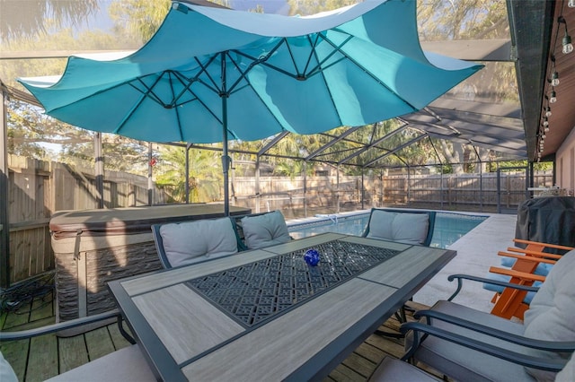 view of swimming pool with a lanai, a fenced backyard, a fenced in pool, and a patio