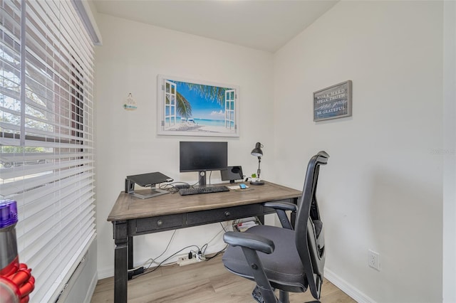 office space featuring wood finished floors and baseboards