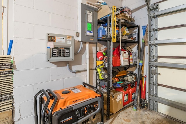 storage area featuring electric panel and a garage