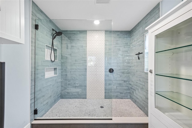 bathroom featuring a shower stall