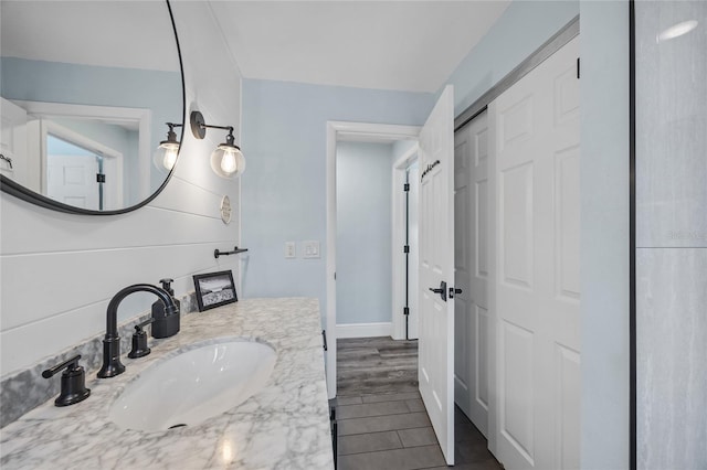 bathroom featuring wood finished floors and vanity