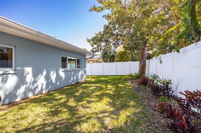 view of yard with a fenced backyard