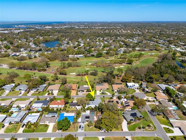 aerial view featuring a residential view, a water view, and view of golf course