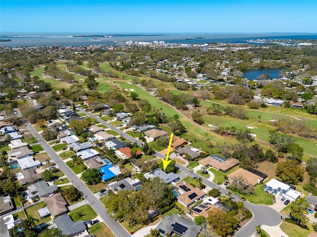 bird's eye view featuring a water view and golf course view