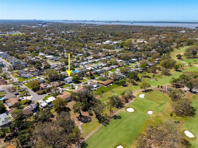 drone / aerial view featuring a residential view, a water view, and view of golf course