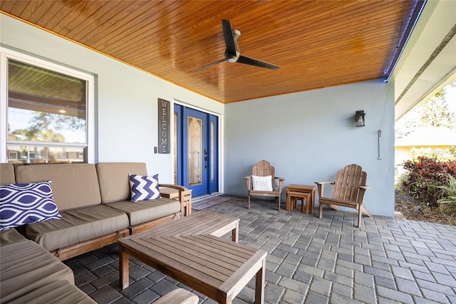 view of patio with outdoor lounge area and ceiling fan