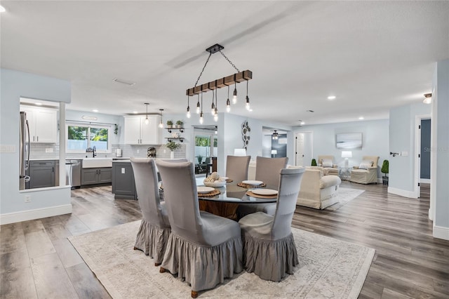 dining area with recessed lighting, wood finished floors, baseboards, and ceiling fan