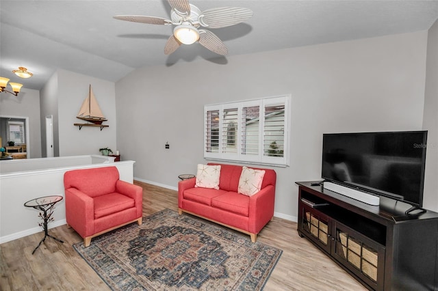 living room featuring a ceiling fan, wood finished floors, and baseboards