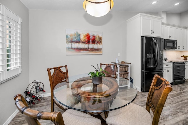 dining area with recessed lighting, baseboards, and light wood-style floors