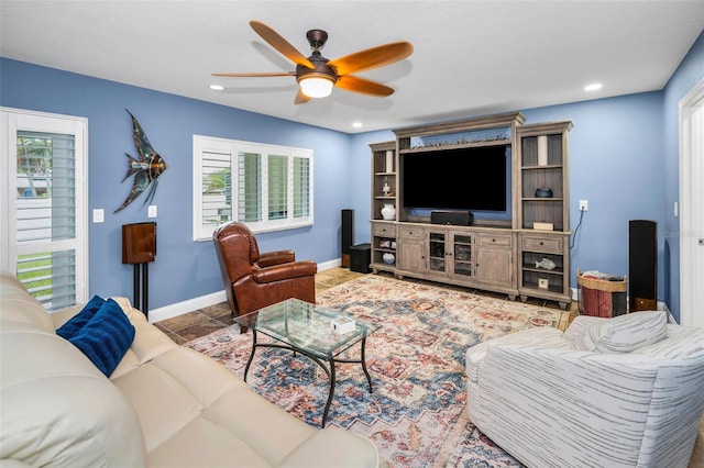 tiled living area featuring a ceiling fan, recessed lighting, baseboards, and a wealth of natural light