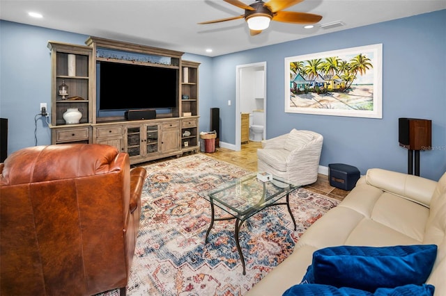 tiled living room featuring a ceiling fan, recessed lighting, baseboards, and visible vents