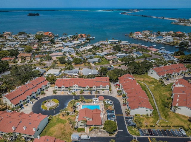 bird's eye view with a water view and a residential view