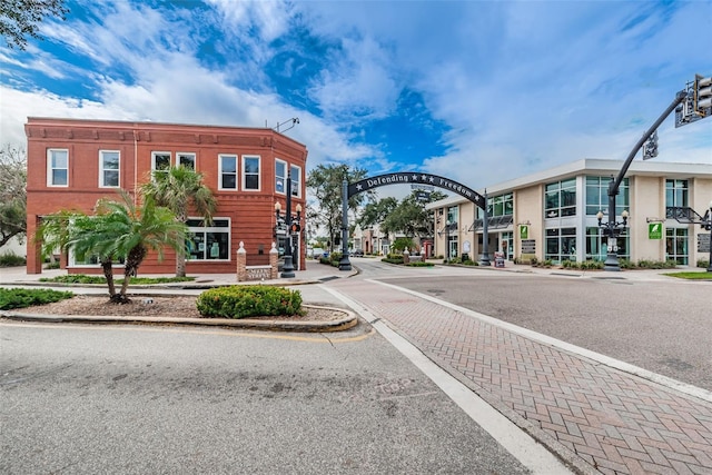 view of road featuring sidewalks and curbs