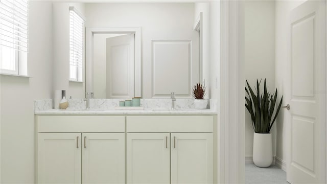 full bathroom featuring a sink and double vanity