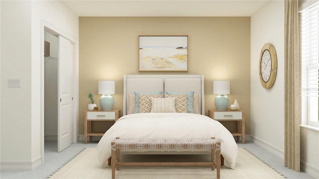 bedroom featuring baseboards and light carpet