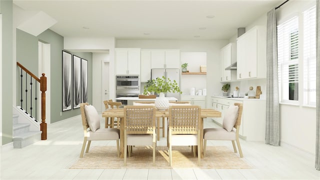 dining area featuring stairway