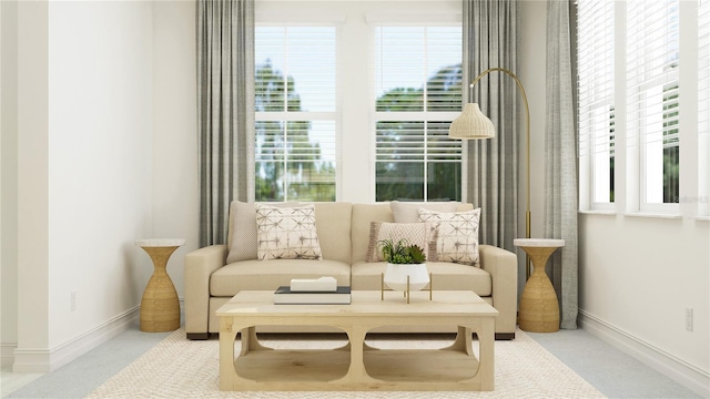 living area with baseboards and carpet floors