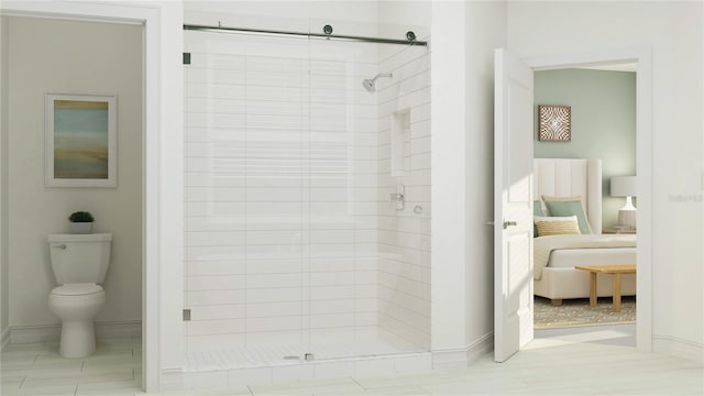 bathroom featuring a stall shower and toilet