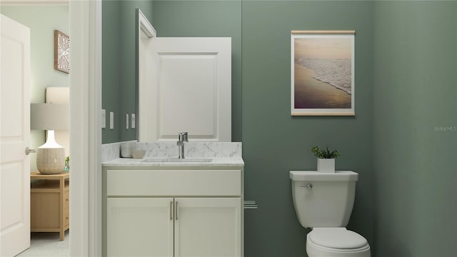 bathroom with toilet and vanity