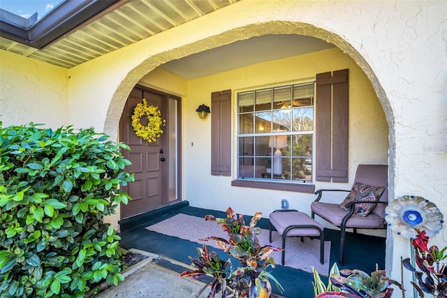 property entrance featuring stucco siding