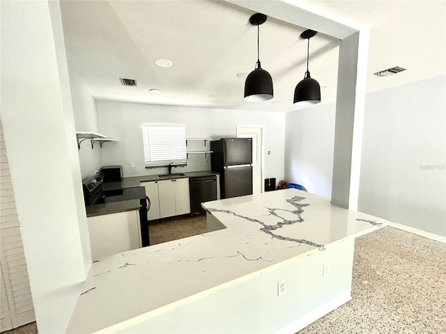 kitchen featuring visible vents, electric range, freestanding refrigerator, a sink, and dishwasher