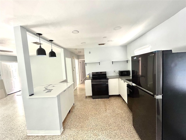 kitchen with black appliances, white cabinets, light speckled floor, and visible vents