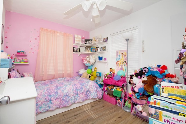 bedroom featuring ceiling fan and wood finished floors