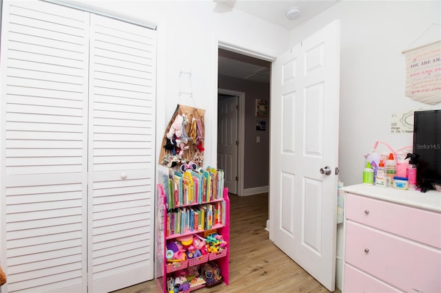 playroom featuring light wood-type flooring