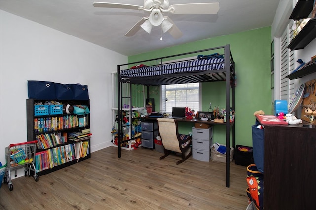 bedroom with wood finished floors