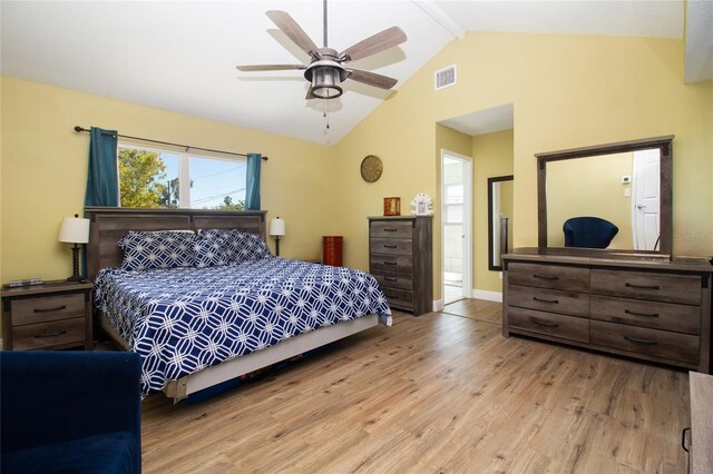 bedroom featuring wood finished floors, baseboards, visible vents, high vaulted ceiling, and beamed ceiling