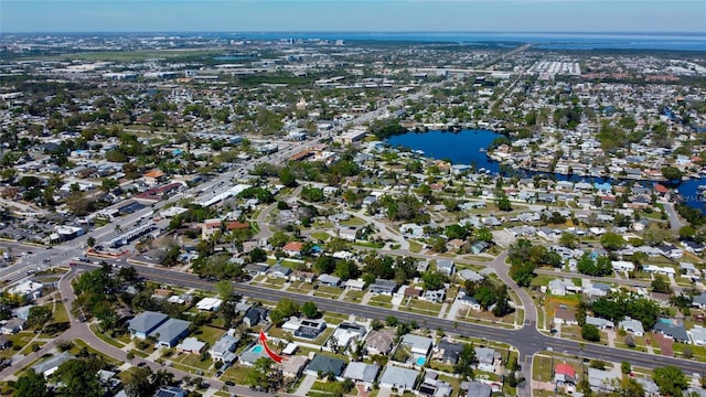 birds eye view of property with a residential view and a water view