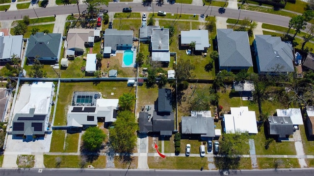 birds eye view of property with a residential view