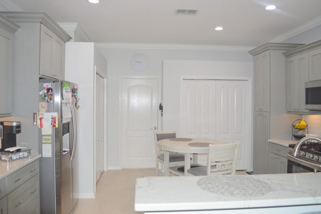 kitchen with visible vents, recessed lighting, gray cabinets, appliances with stainless steel finishes, and crown molding