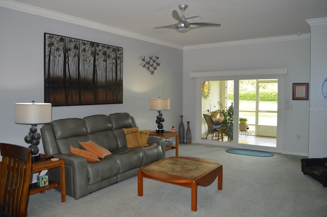 living area with a ceiling fan, carpet, and ornamental molding