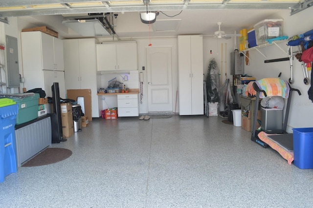 garage with electric panel and a garage door opener