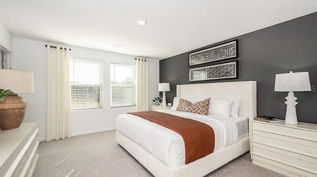 carpeted bedroom featuring baseboards